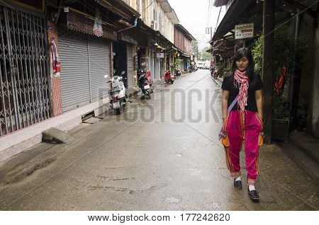 Asian Thai Woman Visit And Travel With Posing For Take Photo At Old Town Chanthaboon