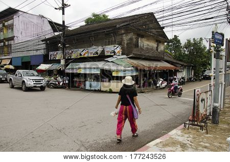 Thai Woman Walking On Street And Traffic Road On The Brigde At Old Town Chanthaboon
