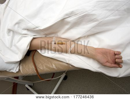 girl hand with drip in vein hospital