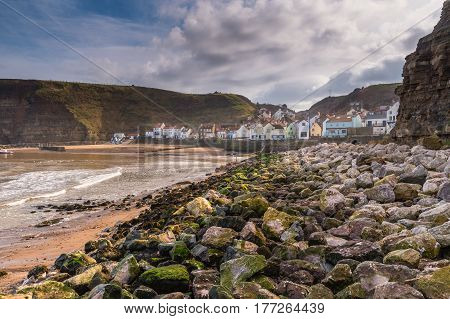Rocks in Staithes Harbour - Staithes is a pretty seaside village and fishing port on the North Yorkshire coastline and is today an attractive tourist destination