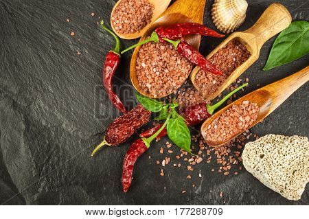 Dried chili peppers and red Hawaiian salt. Sale of spices. Advertising for the sale of spices