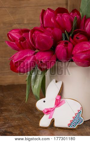 Easter eggs with cake on a wooden table