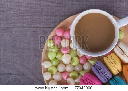 Coffee With Macaron And Aalaw On Wood Table
