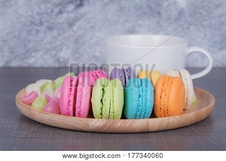 Macaron And Aalaw With Coffee On Wood Table