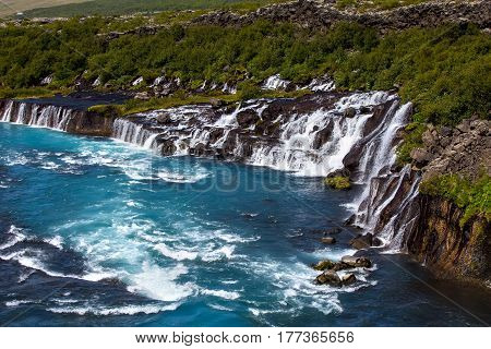 Hraunfossar Series Of Waterfalls Formed By Rivulets Streaming Over A Distance Of About 900 Metres