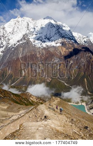 Trekker On The Way To The Valley Covered With Cloud On Manaslu Circuit Trek In Nepal