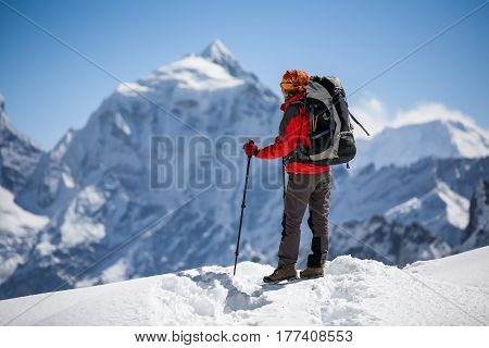 Trekker is walking by Renjo La pass in Everest region