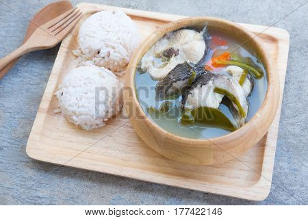 Tom Yum striped snakehead fish served with rice Thailand style food