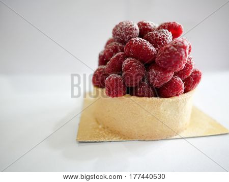 Close up raspberry tart with white background