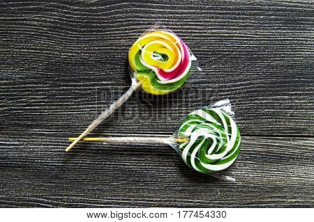 Colorful candies, natural rainbow candy, candies for children in the package, pictures of sugar, pictures of the most beautiful candies, colorful candies on the white floor,