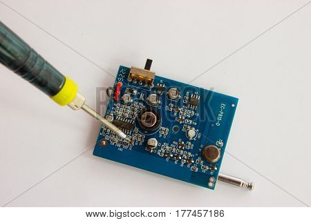 Soldering of tin of electronic componentzs on printed circuit board.