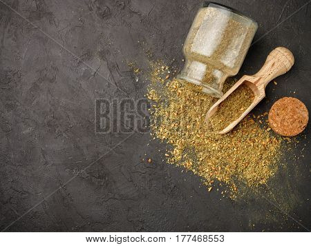 Zaatar - Mix Of Oriental Spices On A Dark Stone Background. Seasoning Made From Dried Herbs, Mixed W