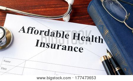 Affordable health insurance form on a table.