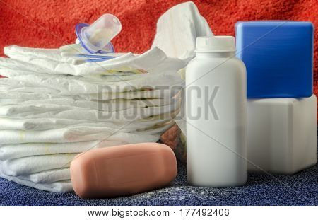 accessories for baby diapers on white background, banny, a bottle of water, cream