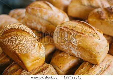 Fresh bread from cereals with seeds from a bakery. Healthy and nutritious food. The product contains carbohydrates.