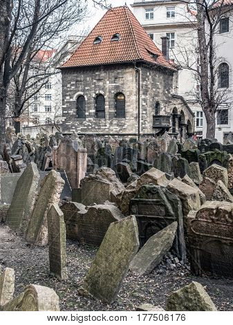 PRAGUE, CZECH REPUBLIC - MARCH 6 2017: Old Jewish cemetery with the Ceremonial Hall in the background, Prague, Czech Republic