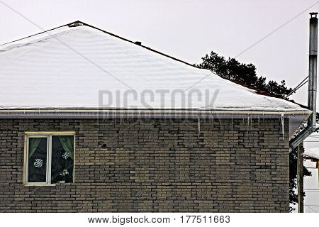 Brick facade of a private house with a window