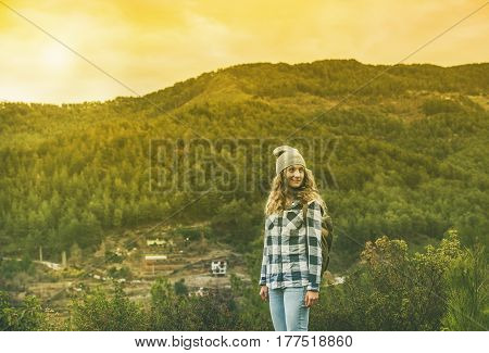 Young woman traveler in chekered shirt hiking in the mountains, Dim Cay district of Alanya, Antalya province, Mediterranean Turkey