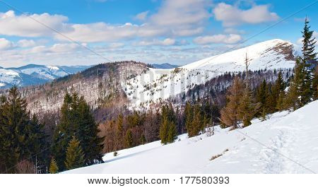 Footsteps On A Hiking Pass In Winter Mountains