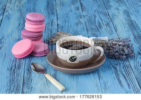 Pink Macaroons And Coffee Cup Near Dried Levender