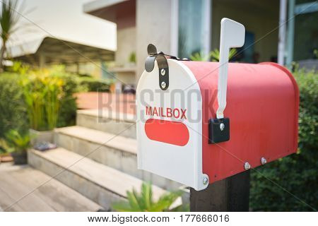 White Mail Box in Front of a House