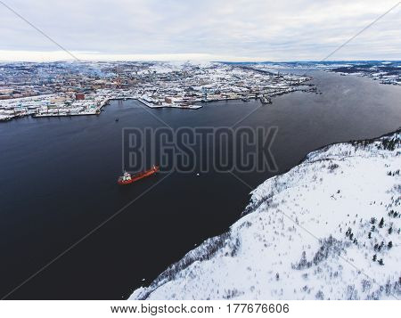 Beautiful aerial air winter vibrant view of Murmansk, Russia, a port city and the administrative center of Murmansk Oblast, Kola peninsula, Kola Bay, shot from quadrocopter drone