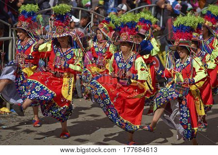 ORURO, BOLIVIA - FEBRUARY 25, 2017: Tinkus dancers in colourful costumes performing at the annual Oruro Carnival. The event is designated by UNESCO as being Intangible Cultural Heritage of Humanity.