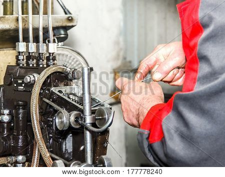 Professional Mechanics Testing Diesel Injector In His Workshop, Repair Of Diesel Fuel Injectors, Ust