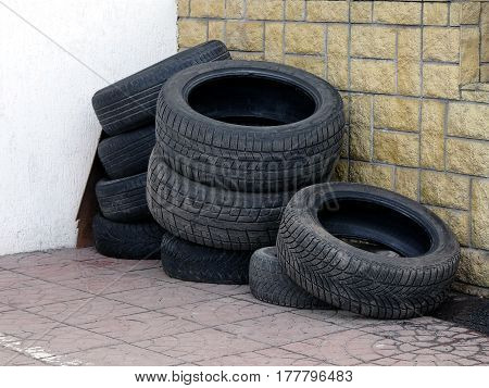 Used tires in the corner of the yard in the warehouse