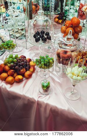 fruits kiwi orange grape peach on the wedding candybar