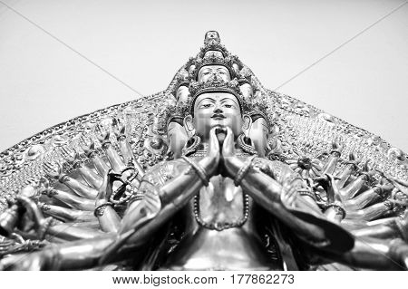 Buddha statue of the Avalokiteshvara. Multi-headed and multi-armed
