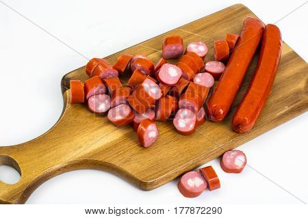Cabbage smoked sausages on wood. Studio Photo