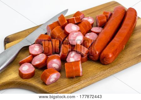 Cabbage smoked sausages on wood. Studio Photo