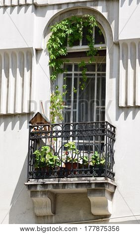 vintage white windows with metal balcony in the house