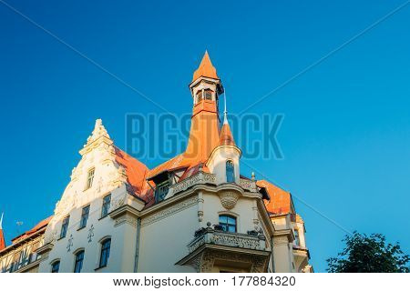 Riga, Latvia. Facade Of Old Art Nouveau Museum Building Designed By Konstantins Pekshens On 12 Alberta Street. Sunny Summer Day Under Blue Clear Sky.