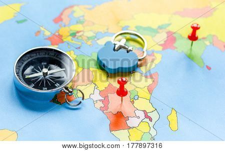 preparetion and booking travel concept with compass on map of the world background