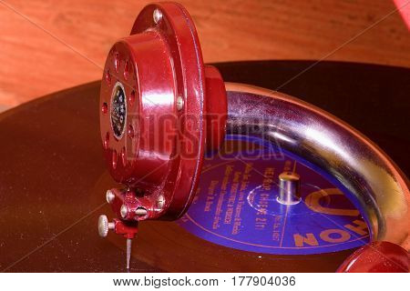 HUSTOPECE CZECH REPUBLIC - MARCH 10 2017: Image shows vintage gramophone (famous Czech brand Supraphone). The red wind-up gramophone and vinyl record (brand Ultraphon).