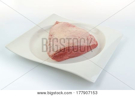 Full Piece Of Fresh Raw Cow Beef (picanha) On A White Dish With White Background