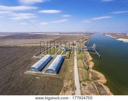 Grain storage silos and grain elevator at the port. Aerial view.
