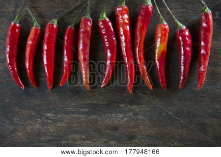 Red hot chilli pepper on wooden tabel background