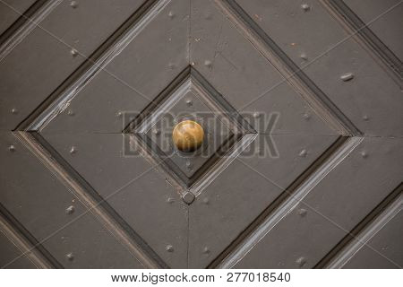 Old Door Of A Historical Building With Iron Door Knob