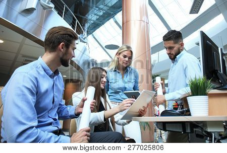Group Of Young Modern People In Smart Casual Wear Having A Brainstorm Meeting While Standing In The 