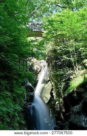 Long Exposure Of A Waterfall At Aira Force Waterfall Park In The Lake District In Cumbria