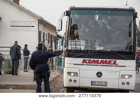 Sid, Serbia - November 14, 2015: Crowd Of Refugees Waiting To Unboard A Bus To Cross The Croatia Ser
