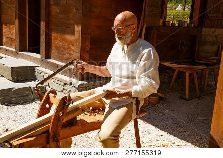 Gudvangen, Norway - June 13 - The Man Carpenter In National Clothes In The Viking Village Museum.