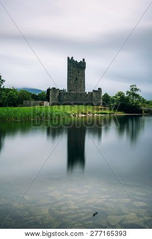Ross Castle Ruins And The Lough Leane Lake Located In The Killarney National Park, Ireland. Long Exp