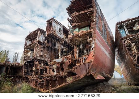 Huge Rusty Pieces Of Decommissioned Marine Ship That Was Cut And Left On The Shore.