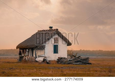 Sunset Over House Of Shepherds In Hortobagy National Park, Hungary, Puszta Is Famous Ecosystems In E