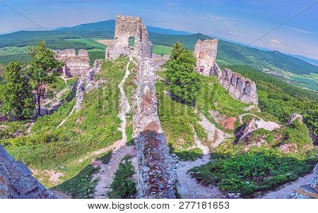 Ruins Of The Castle Gymes In Slovak Republic. Travel Destination. Panoramic Photo. Purple Photo Filt