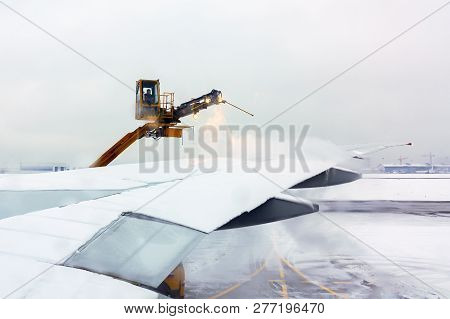 Moscow, Russia - December 11, 2018: Process Of De-icing The Aircraft Before The Flying In The Winter